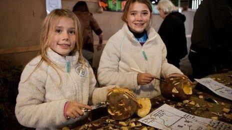 Emily Jones, 11 and Lizzie Jones, nine, carving their Turnips at Cregneash