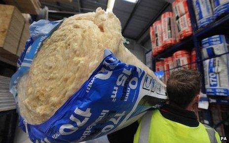 Man carrying insulation