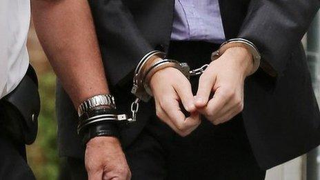 Handcuffs on suspect in UK - file pic