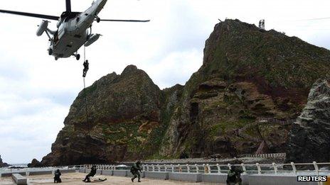 Members of South Korean security forces take part in a drill at a set of remote islands called Dokdo in Korean and Takeshima in Japanese on 25 October 2013