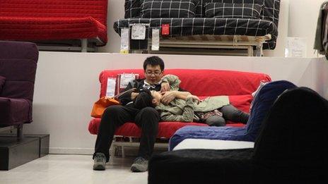 A couple on a sofa in Ikea