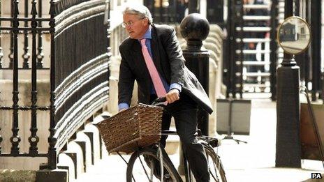 Andrew Mitchell arriving at Downing Street on his bicycle