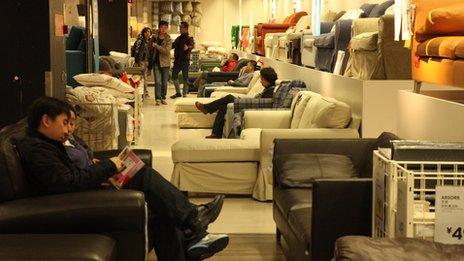 People sit on sofas in Ikea