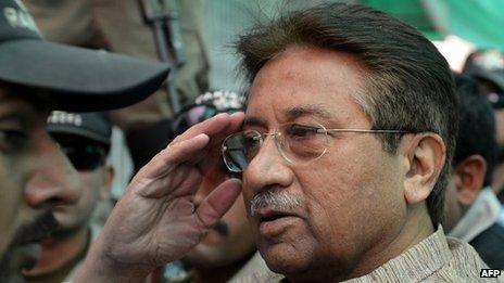 In this photograph taken on April 20, 2013, Former Pakistani president Pervez Musharraf (C) is escorted by soldiers as he salutes on his arrival at an anti-terrorism court in Islamabad.