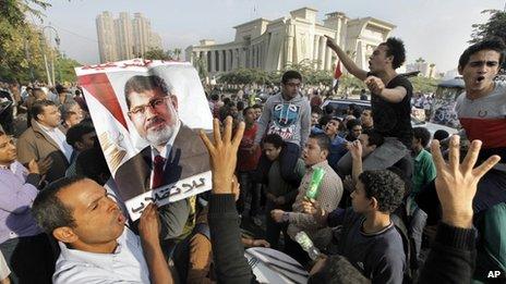 Supporters of Egypt's ousted President Mohammed Morsi hold a a protest against Morsi's trial in front of the supreme constitutional court in Cairo, on Monday 4 November 2013