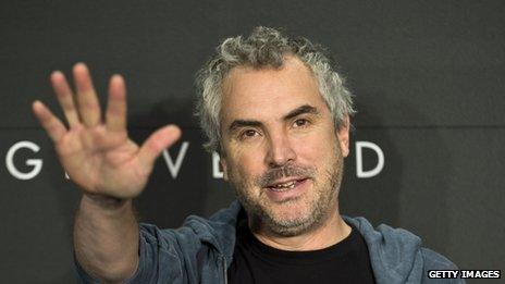 Mexican film director Alfonso Cueron poses for a photos as he promotes his latest film "Gravedad" in Mexico City, 16 October 2013