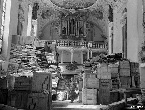 Nazi-looted art guarded by US soldier in church in occupied Germany, 1945