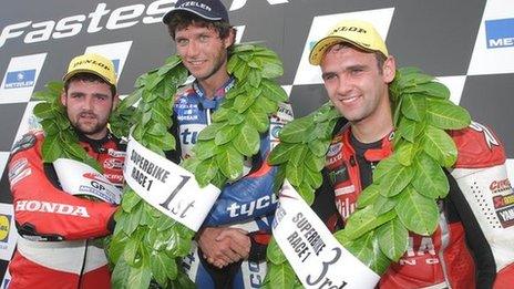 Michael Dunlop, winner Guy Martin and William Dunlop on the podium after the main Superbike race at last year's Ulster GP