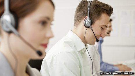 Call centre callers at work (staged)