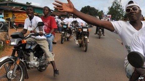 People on motorbikes in Monrovia, Liberia