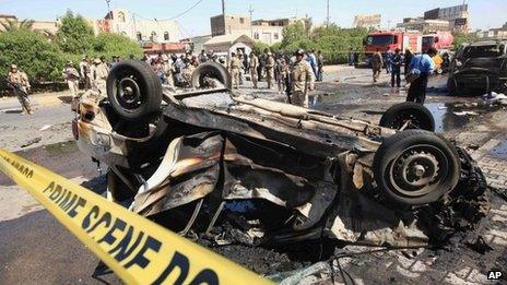 Aftermath of a bombing in the Iraqi city of Basra on 13 October 2013