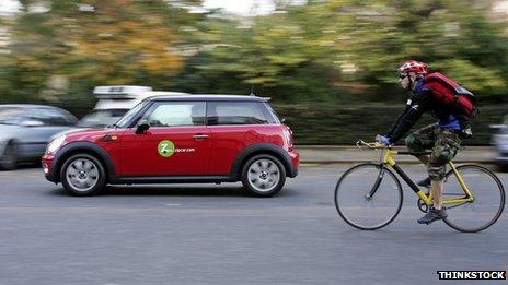 A car passing a cyclist