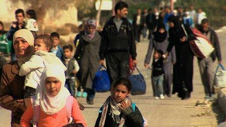 A large group of people flee the area of Moadamiya