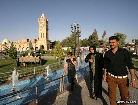 People walk in Irbil