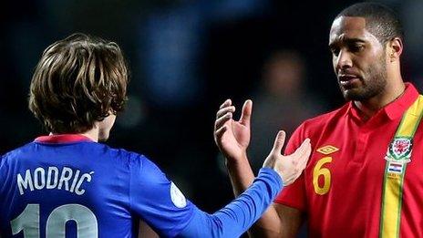 Ashley Williams (right) shakes hands with Croatia's Luka Modric in March, 2013