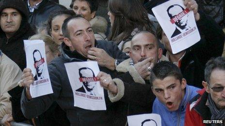 Protesters shout during Armistice event attended by French President Francois Hollande