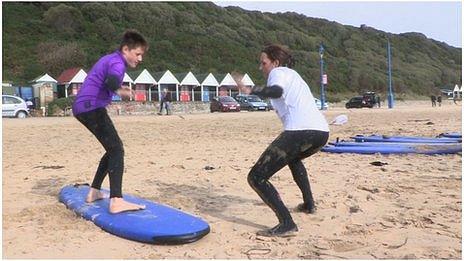 Brandon and Zoe perfecting surfing skills