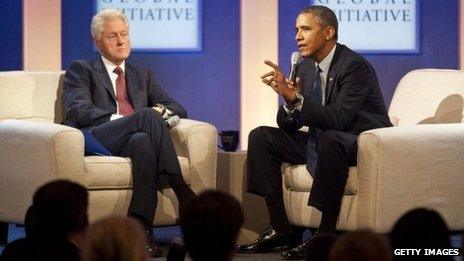 Former US President Bill Clinton (left) listens to US President Barack Obama at the Clinton Global Initiative in New York City on 24 September 2013