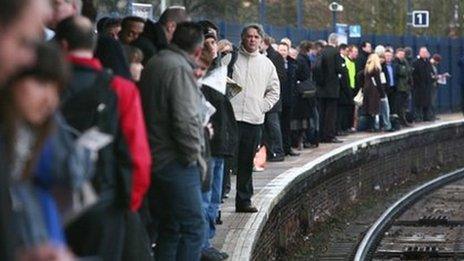 Commuters on train platform