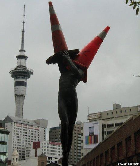 Why do people put traffic cones on statues? - BBC News