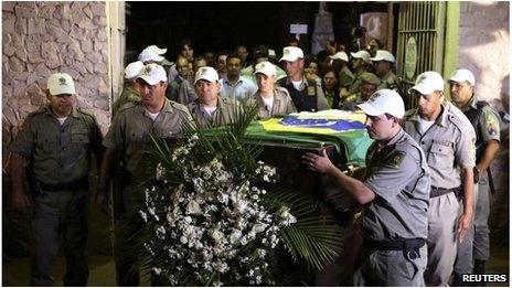 The exhumed remains of Brazils former president Joao Goulart are carried from the Jardim da Paz cemetery in Sao Borja on 14 November, 2013