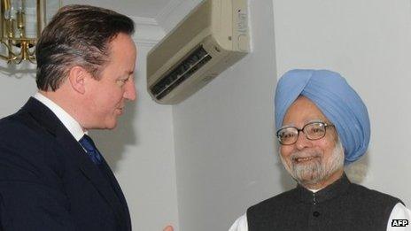 India's prime minister Manmohan Singh shakes hands with British Prime Minister David Cameron ahead of a meeting in New Delhi