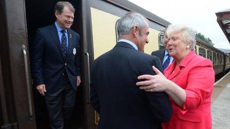 US Captain Tom Watson and European Captain Paul McGinley are greeted by the Provost for Perth and Kinross Liz Grant at Gleneagles train station