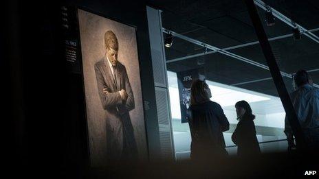 People view an exhibit about the 1963 JFK assassination at the Newseum in Washington DC 26 September 2013