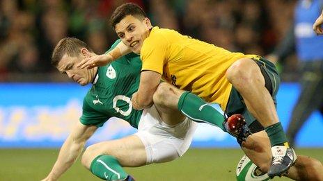 Ireland's Brian O'Driscoll tackled by Matt Toomua of Australia