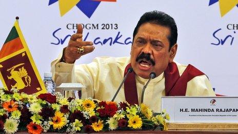 Sri Lankan President Mahinda Rajapaksa gestures as he answers during a media briefing on the final day of the Commonwealth Heads of Governments Meeting (Chogm) in Colombo