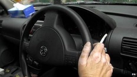 Man smoking in car