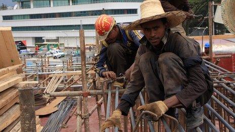 Solomon Getachew works on a raised section of the rail track in Addis Ababa