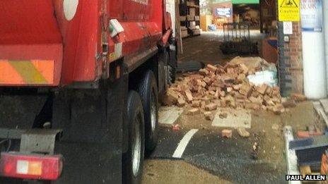 Pile of bricks by the truck's wheels