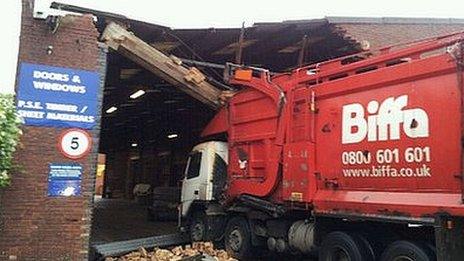 Truck in the front of the warehouse