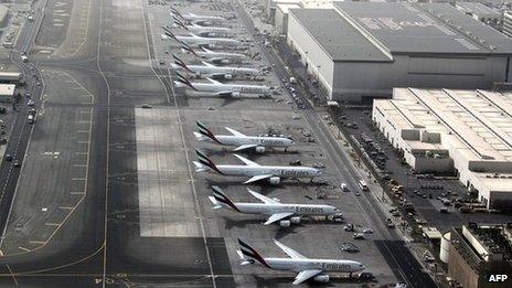 Planes parked on tarmac at Dubai airport