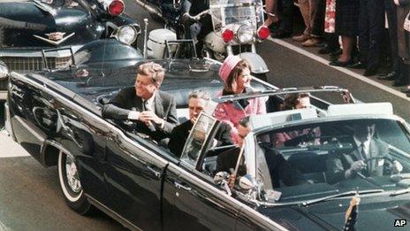 President John F. Kennedy's motorcade travels through Dallas, Texas on 22 November 1963