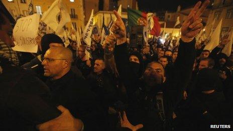 Demonstrators try to approach the Portuguese parliament in Lisbon on 21 November