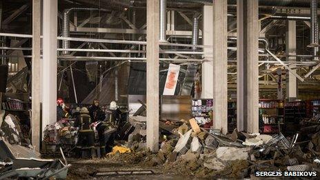 Shelves can been seen inside the store in this photograph taken in the immediate hours after the roof collapsed in Riga