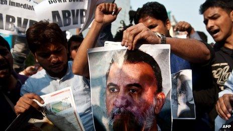 Activists of Akhil Bharatiya Vidya Parishad (ABVP) burn a photograph of Tarun Tejpal in November 2013