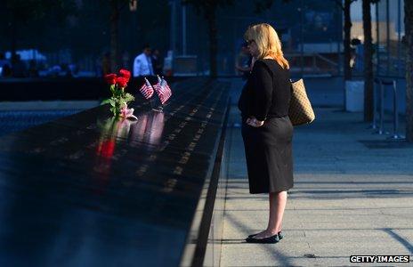 Woman stands at 9/11 memorial