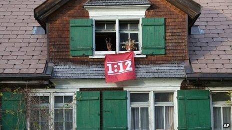 Banner supporting campaign for cuts in executive pay in Switzerland, 25 October 2013