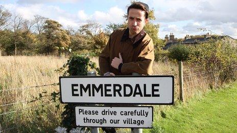 Nick Grimsaw with Emmerdale sign