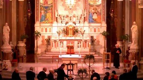 Fr Alec Reid lying in repose at Clonard Church