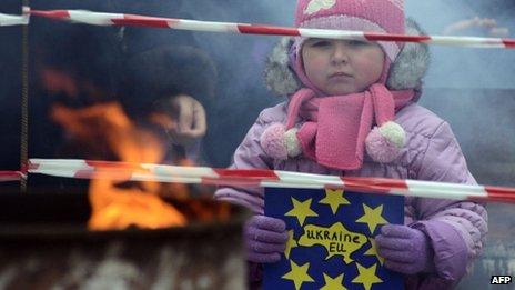 A girl holds a placard reading "Ukraine-EU" in Ivano-Frankivsk, western Ukraine. Photo: 26 November 2013