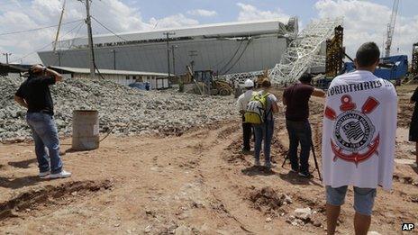 People gather at the site of the accident