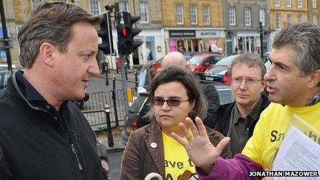 David Cameron in Chipping Norton being confronted by ACE Centre protesters