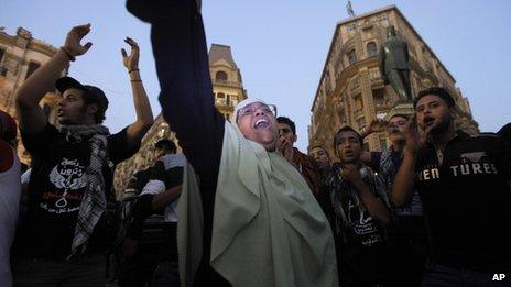 Egyptian protesters chant slogans during a protest in Talaat Harb Square in Cairo, Egypt, against the issuance of a new law regulating demonstrations, Thursday, Nov. 28, 2013.