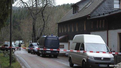 Police cars are parked in Gimmlitztal near the town of Hartmannsdorf-Reichenau, south of Dresden, November 29, 2013