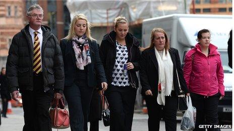 Family members and loved ones of murdered soldier Lee Rigby, Ian Rigby, his stepfather (L), his sister Sara McClure (C) and his mother Lyn Rigby (2-R) arrive at the Old Bailey in London on November 29, 2013