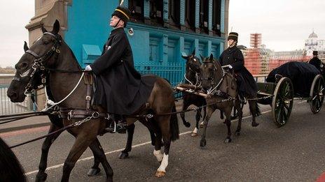 Members of the Household Cavalry Mounted Regiment transport "sacred soil" from First World War battlefields over Tower Bridge,
